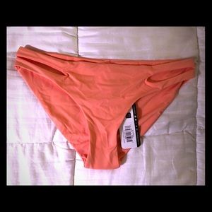Coral bikini bottoms with cutouts